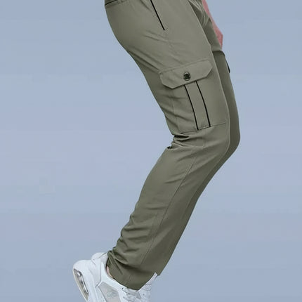 Green cargo pants worn by a person on a gray background with DAZZLE brand logo.