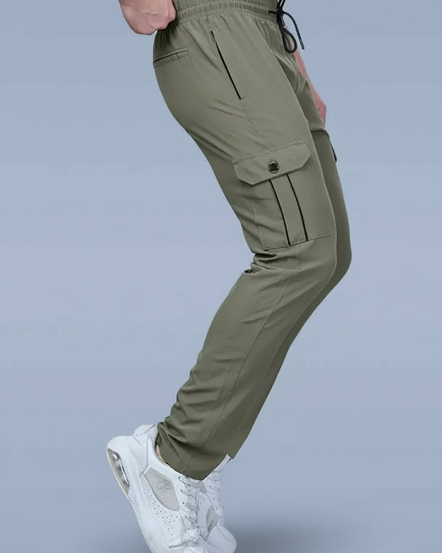Green cargo pants worn by a person on a gray background with DAZZLE brand logo.