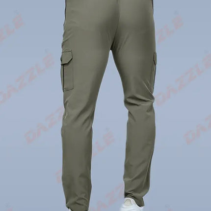 Green cargo pants worn by a person on a light gray background