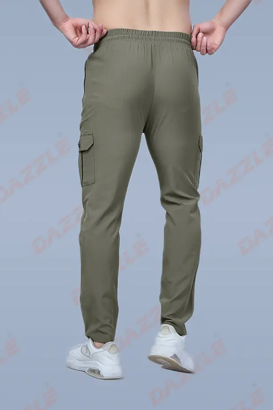 Green cargo pants worn by a person on a light gray background