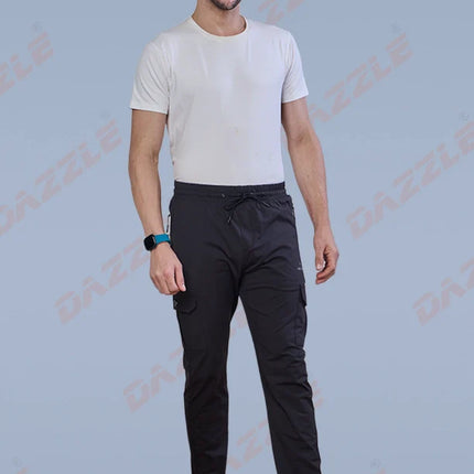 Man wearing a white t-shirt and black pants on a light blue background