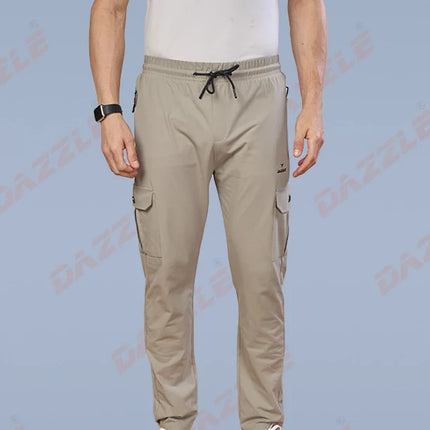 Person wearing beige cargo pants on a light blue background