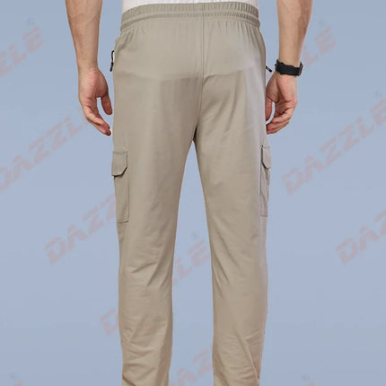 Beige cargo pants worn by a person on a light blue background with 'Galleon' branding.