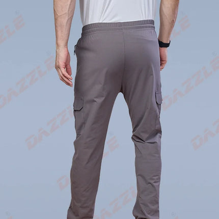 Person wearing gray cargo pants on a light blue background with 'DAZZLE' branding.